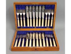 An oak James Dixon & Sons 24 piece silver plated f