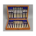 An oak James Dixon & Sons 24 piece silver plated f