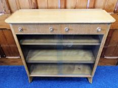 A mid 20thC. retro oak book case with two drawers