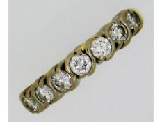 An 18ct yellow gold half eternity ring set with ap