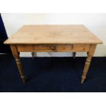An antique scrub top farmhouse table with drawer,