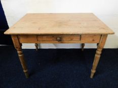 An antique scrub top farmhouse table with drawer,