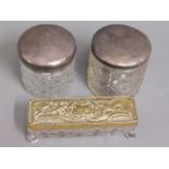 Two silver topped dressing table tidies & one othe
