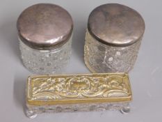 Two silver topped dressing table tidies & one othe