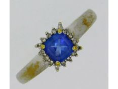 A 18ct white gold ring set with tanzanite & diamon