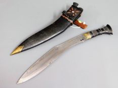 A kukri knife with leather scabbard, 17.125in long