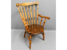 An antique elm seated arm chair, one arm loose