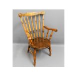 An antique elm seated arm chair, one arm loose