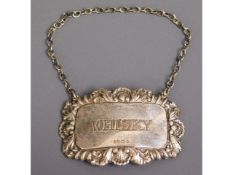 A 1996 Birmingham silver whisky decanter tag by Ra