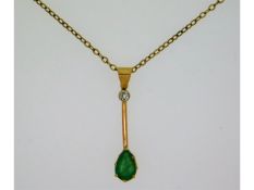 An antique style yellow metal pendant with 28mm drop, tests electronically as 18ct gold, set with di