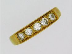 An 18ct gold five stone diamond ring of 0.32ct, 2.