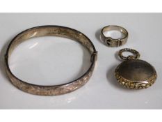 A silver bangle. silver buckle ring & silver locke