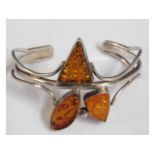 A silver bangle set with amber, 32.8g