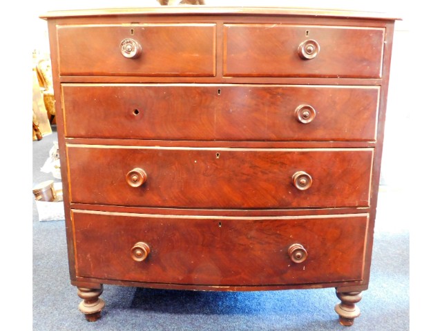 A Victorian bow fronted mahogany chest of drawers,