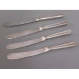 Four silver handled cake knives