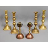 Two pairs of 19thC. brass candle holders twinned w