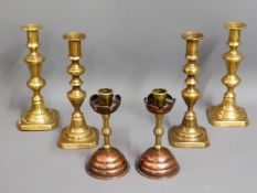 Two pairs of 19thC. brass candle holders twinned w