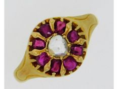 An 18ct gold ring set with rose cut ruby & diamond