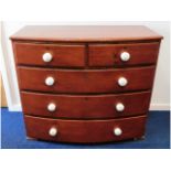A Victorian stained pine chest of drawers with por