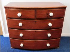 A Victorian stained pine chest of drawers with por