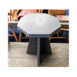 A heavy octagonal cut slate garden table, 17in hig