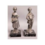 Two marble mounted spelter figures, 7in tall