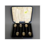 A cased set of art deco silver coffee bean teaspoo