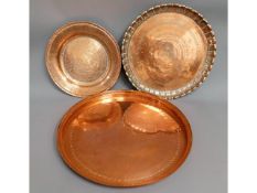 Three copper trays including a heavy gauge Islamic
