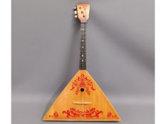 A Russian balalaika stringed instrument, 27in long