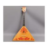 A Russian balalaika stringed instrument, 27in long