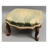 A Victorian upholstered footstool, one foot damage