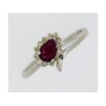 A 9ct white gold ring set with ruby & approx. 0.13