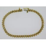 An 18ct gold tennis bracelet set with approx. 2.08