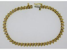 An 18ct gold tennis bracelet set with approx. 2.08