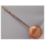 A Victorian copper warming pan, 41in long
