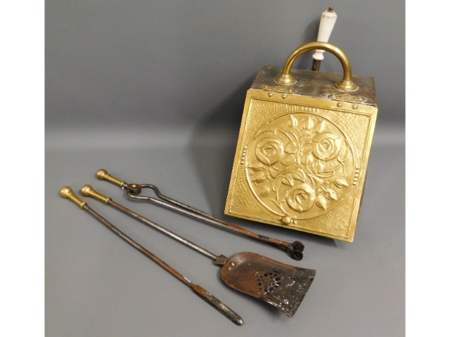 A coal scuttle & brass companion set