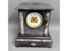 A Victorian slate mantle clock with marble columns