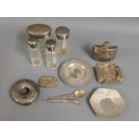 Four 0.950 silver topped jars, a silver pin dish,