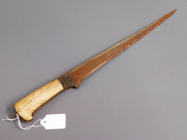 An antique ivory handled short sword, brought back