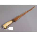 An antique ivory handled short sword, brought back