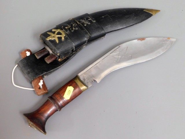 A Nepalese kukri knife with leather scabbard & woo