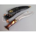 A Nepalese kukri knife with leather scabbard & woo