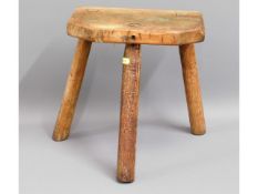 An oak rustic milking stool, 13in tall