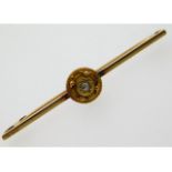 An antique 15ct gold brooch set with small diamond