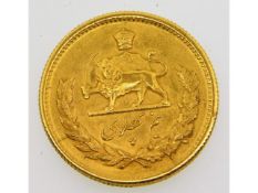 A gold Iranian half Pahlavi coin, 4.2g