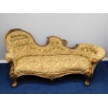 A 19thC. ornate, carved walnut chaise longue, 81in