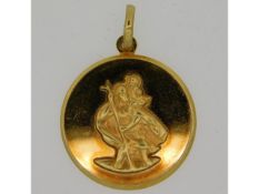 A 9ct gold St. Christopher pendant, 27mm diameter,