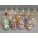 Twenty advertisement milk bottles