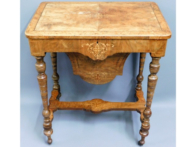 A Regency walnut work table with contents, 27.5in