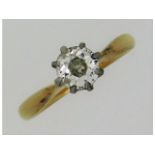 An antique 18ct gold solitaire ring set with appro